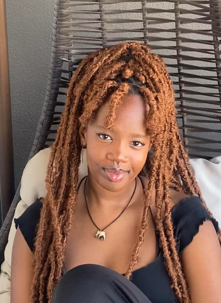 Nyakwea Ndegwa smiles solemnly